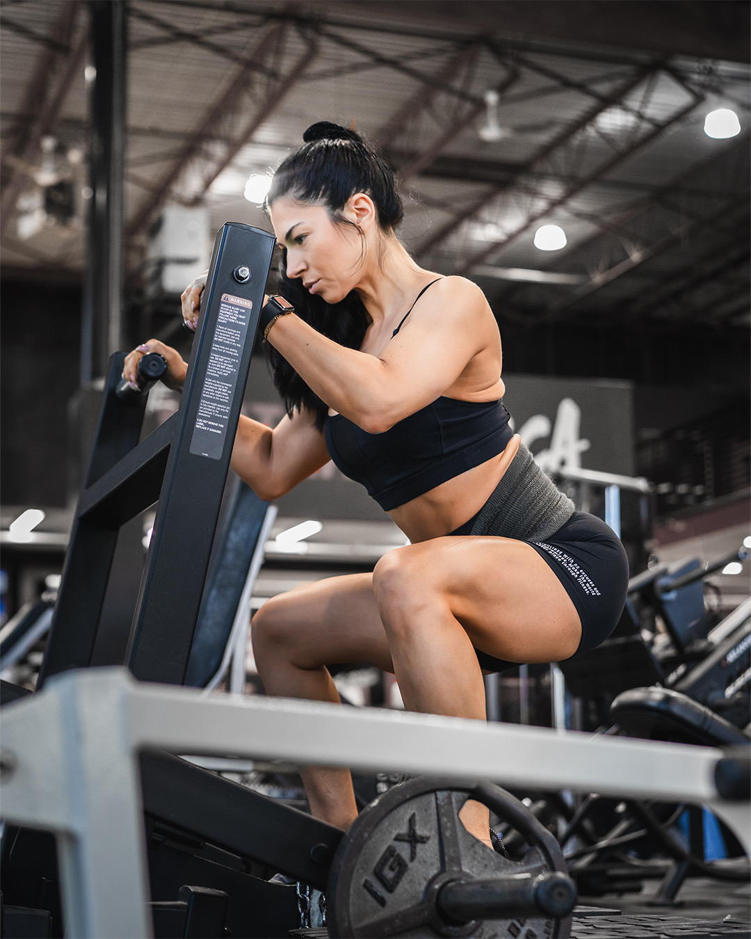 woman at gym working on her legs